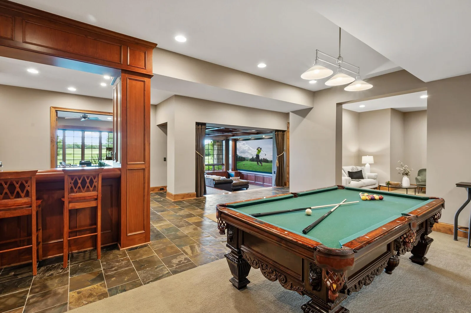The lower level is an entertainment paradise! Featuring a fantastic theater room, pool table, and a stylish bar area.