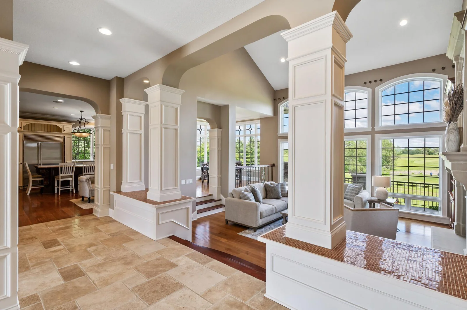 Soaring ceilings and abundant natural light enhance the open and airy living space.