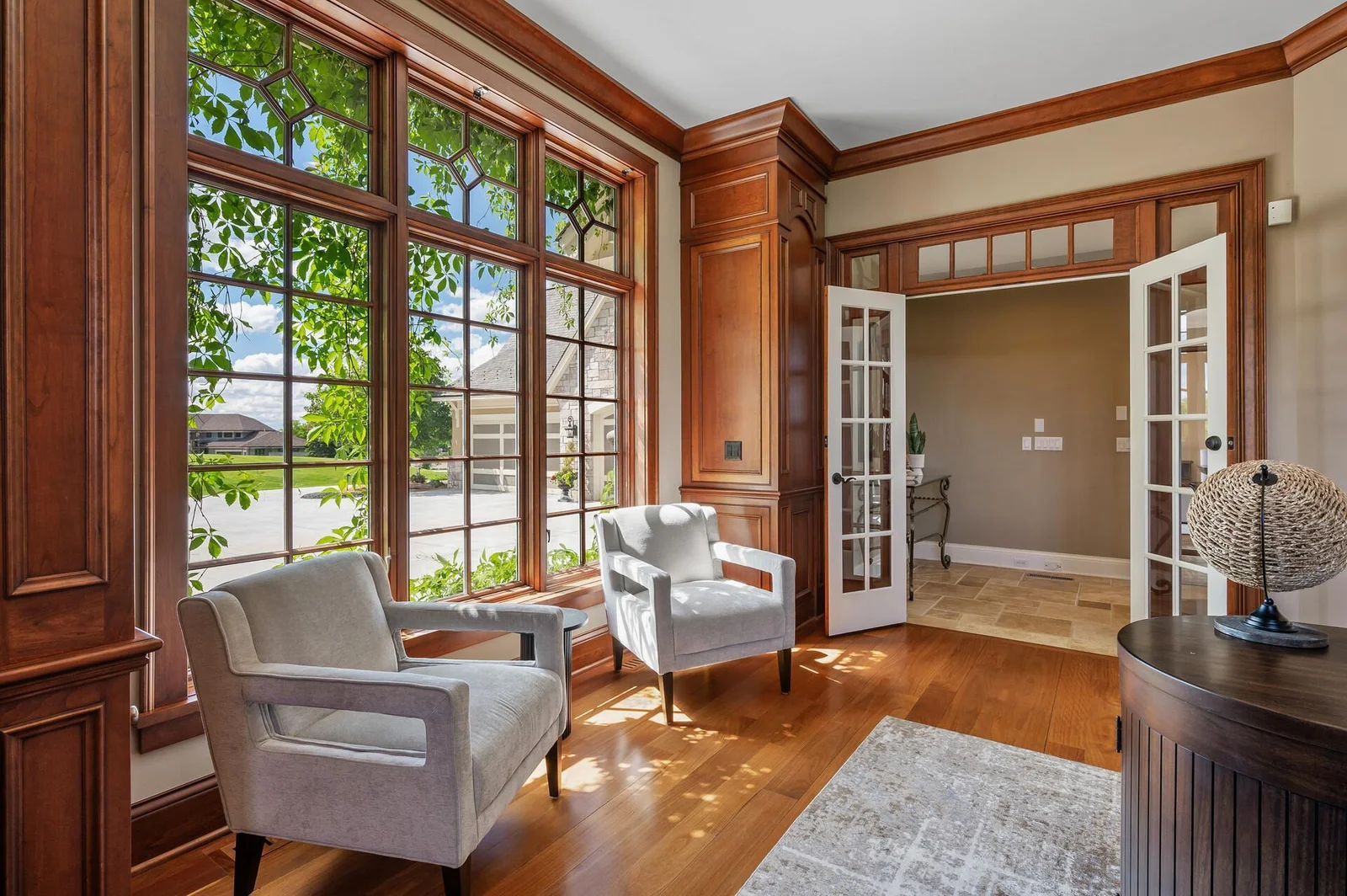 The beautiful wood paneling and large windows enhance the character of this lovely office space.