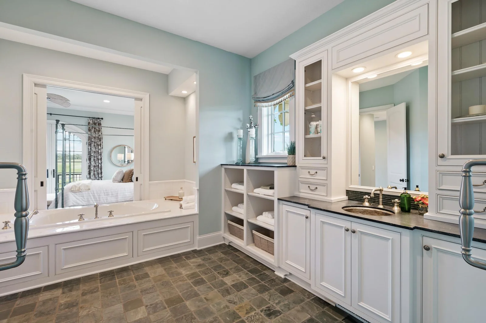 From the soaking tub to the dual vanities and easy access to the primary bedroom, this ensuite is designed for ultimate comfort and convenience.