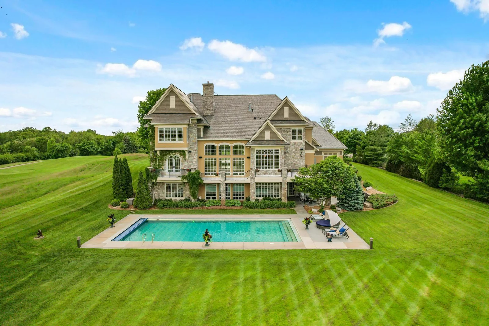 Stunning pool and vast lawn perfect for outdoor recreation.