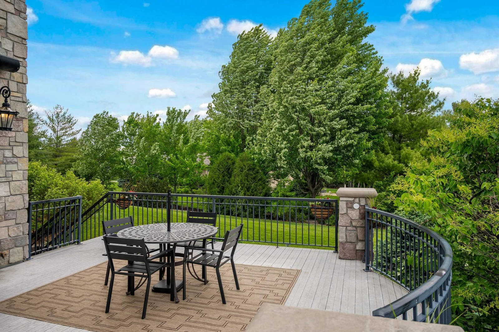 This upper deck offers the perfect setting for outdoor meals and gatherings, with ample space for dining.