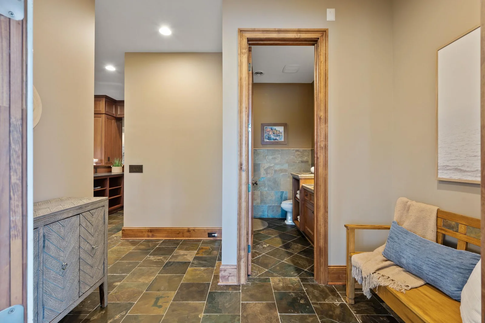 Designed for convenience, this lower level bathroom is readily available for anyone enjoying the pool or the various entertainment spaces.
