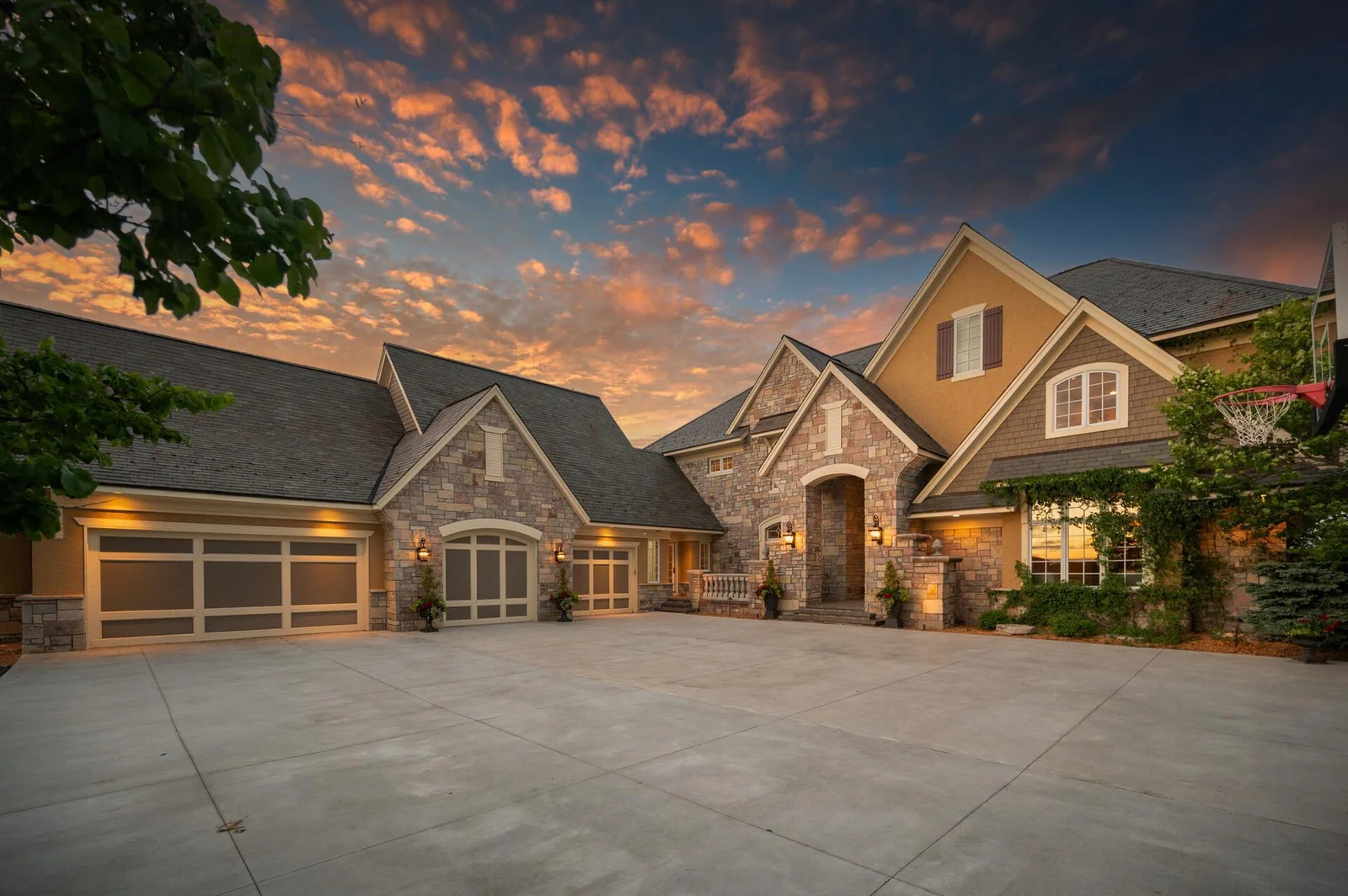 A breathtaking view of this exceptional home, featuring its expansive 6-car garage and inviting entrance.