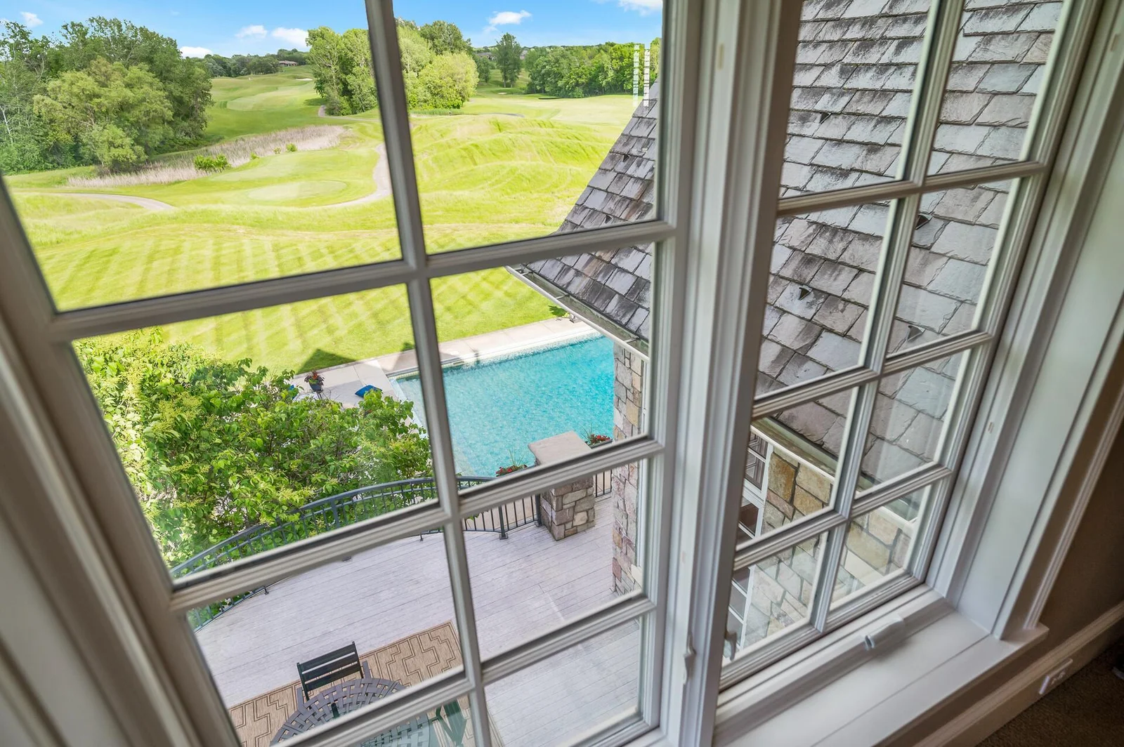 Enjoy a bird's-eye view of your private pool and the stunning golf course from the upper level.