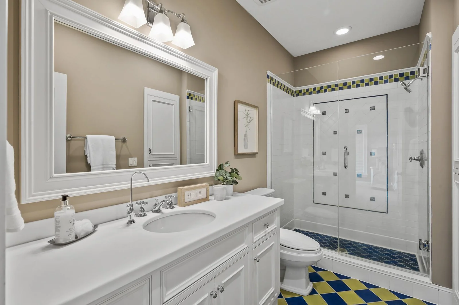 Convenient ensuite bathroom on the upper level, featuring a stylish shower and vanity.