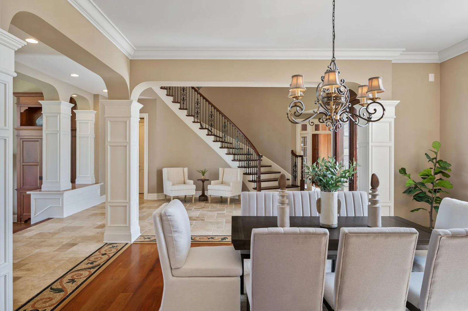 Elegant dining room, with the grand foyer just beyond.
