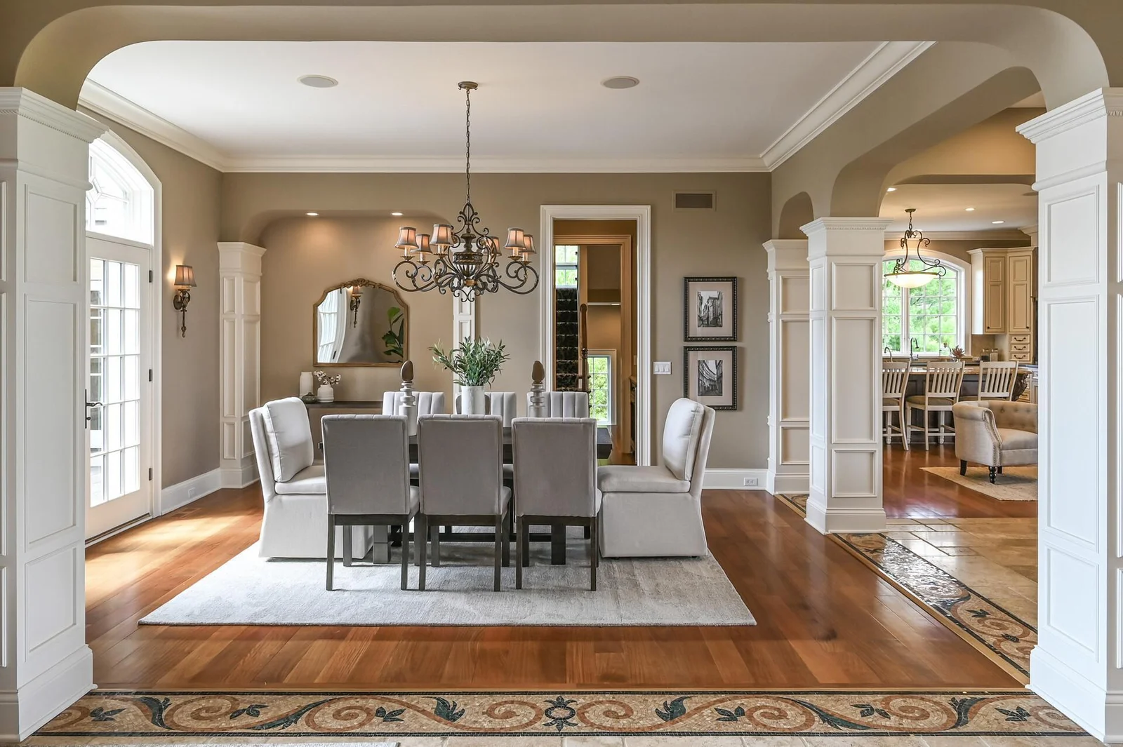 The intricate custom tile detailing reflects the builder's dedication to superior craftsmanship and elevates the sophisticated design of this home.