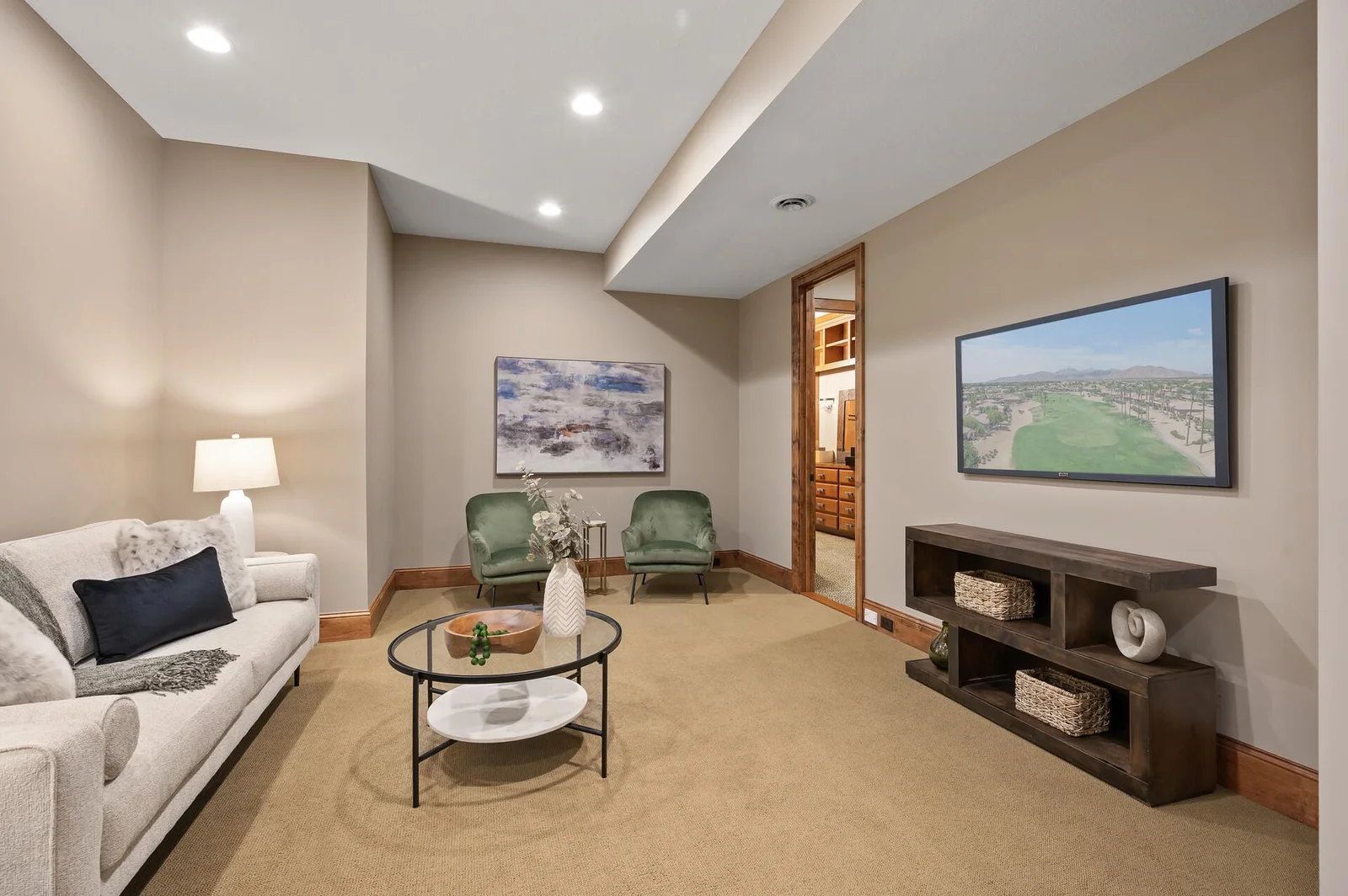 This comfortable and versatile living area on the lower level offers additional space for relaxation or entertaining.