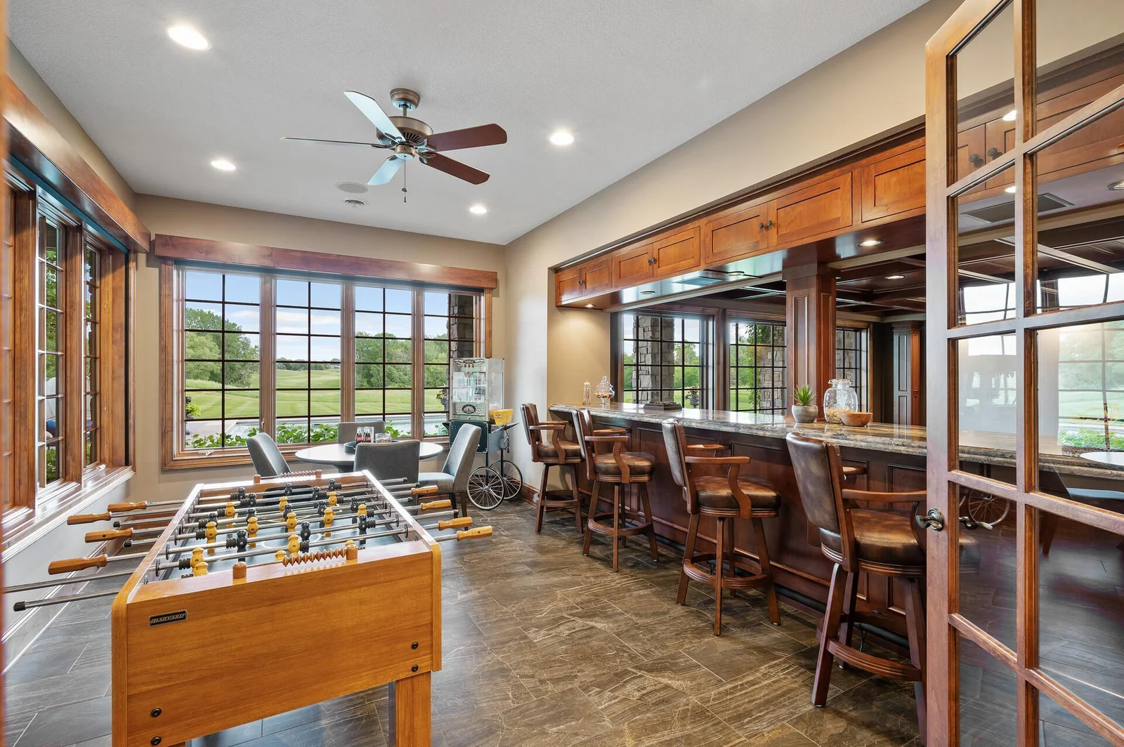 This lower level space seamlessly connects you to the beauty of the outdoors with its large windows and views.