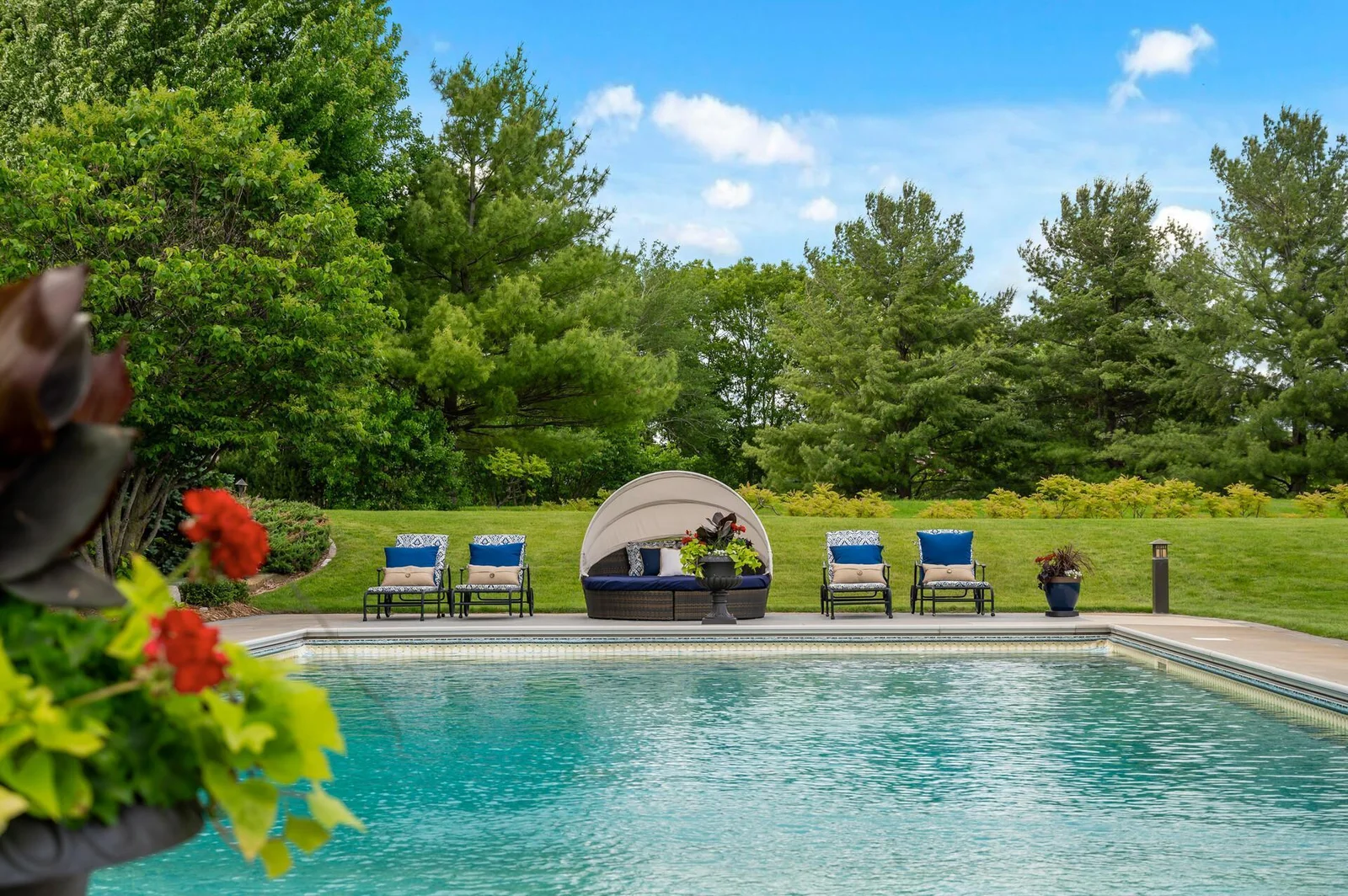 Your own private backyard oasis awaits! Enjoy the refreshing pool and the serene natural setting.