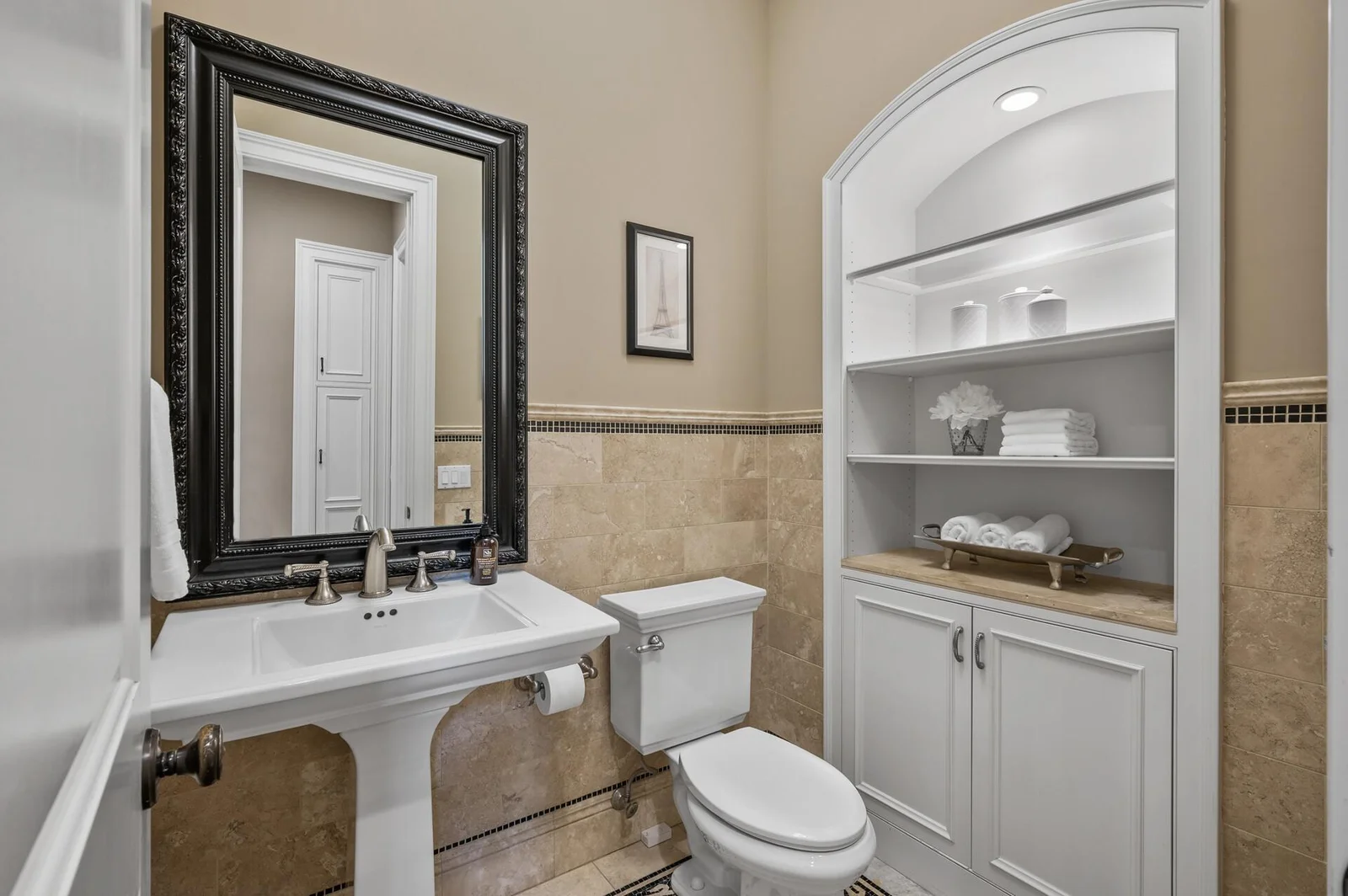 A beautifully appointed half bath on the main level.