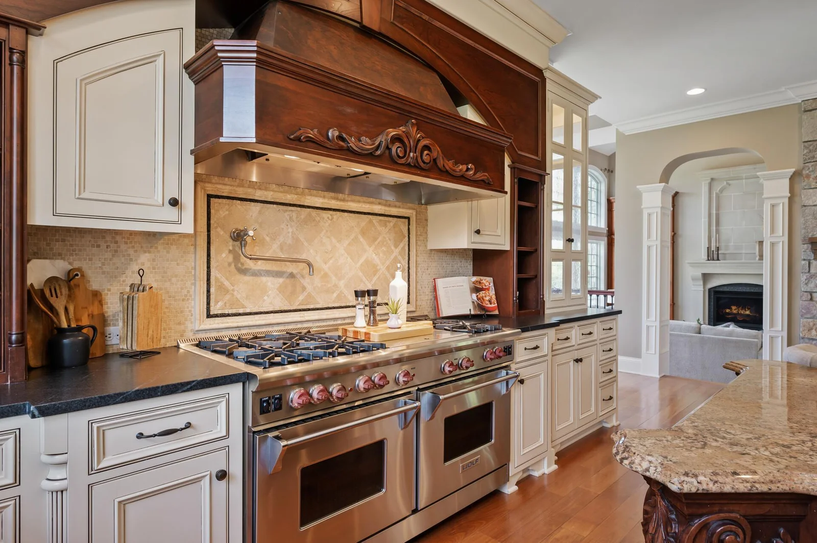 The kitchen and adjacent sitting room create a central hub for living and entertaining.