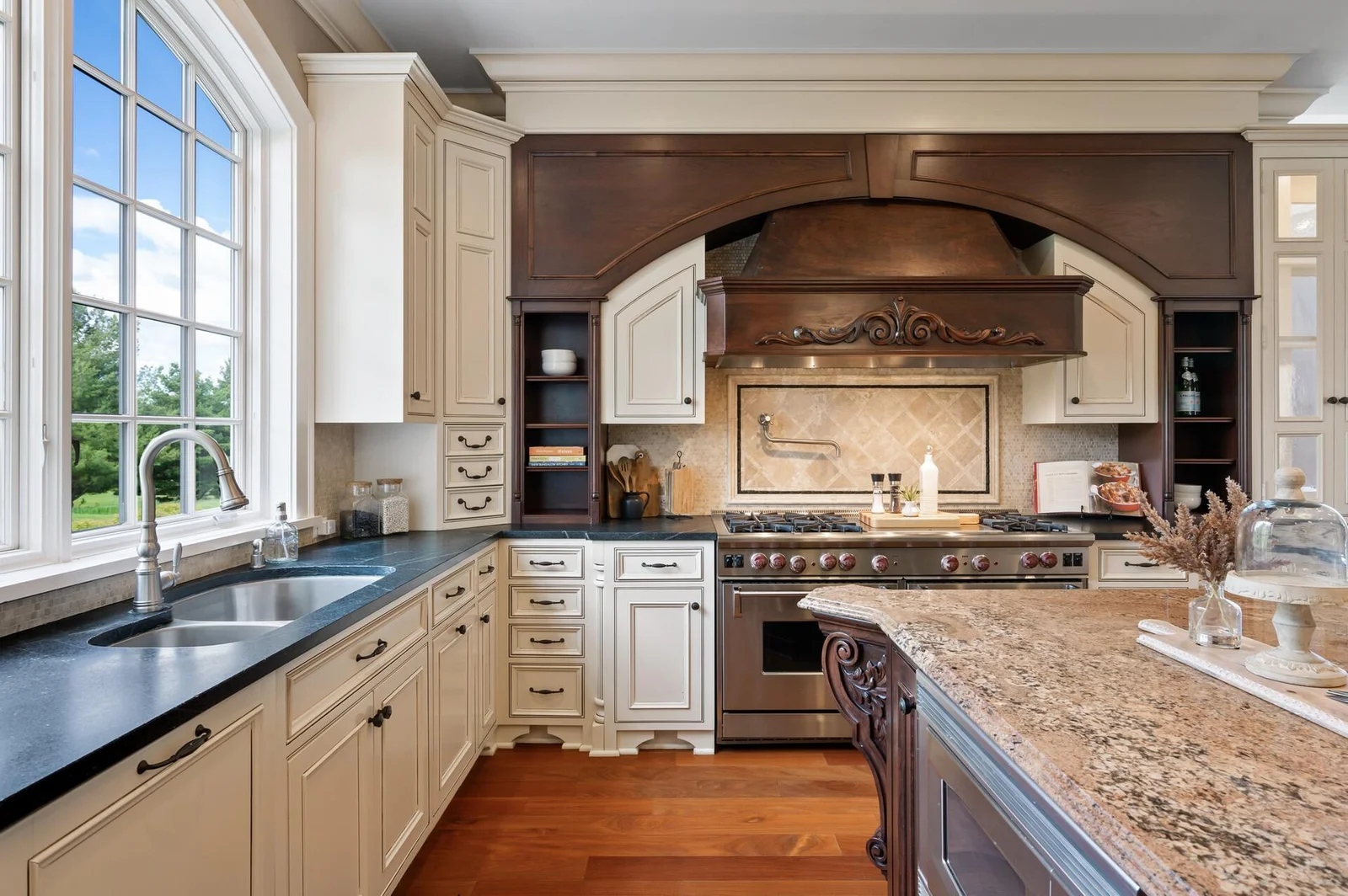 Beautifully appointed kitchen with custom design and impressive Wolf range.