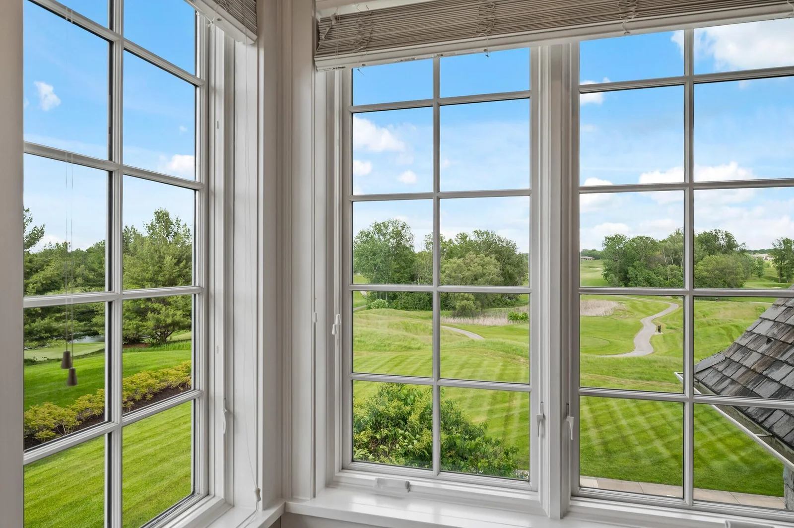 Bright natural light floods this upper level space, offering picturesque views of the beautiful landscape.