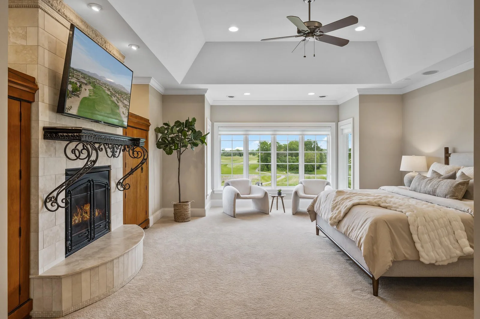 Relax in the comfortable sitting area by the windows and enjoy the views from the expansive second primary suite.
