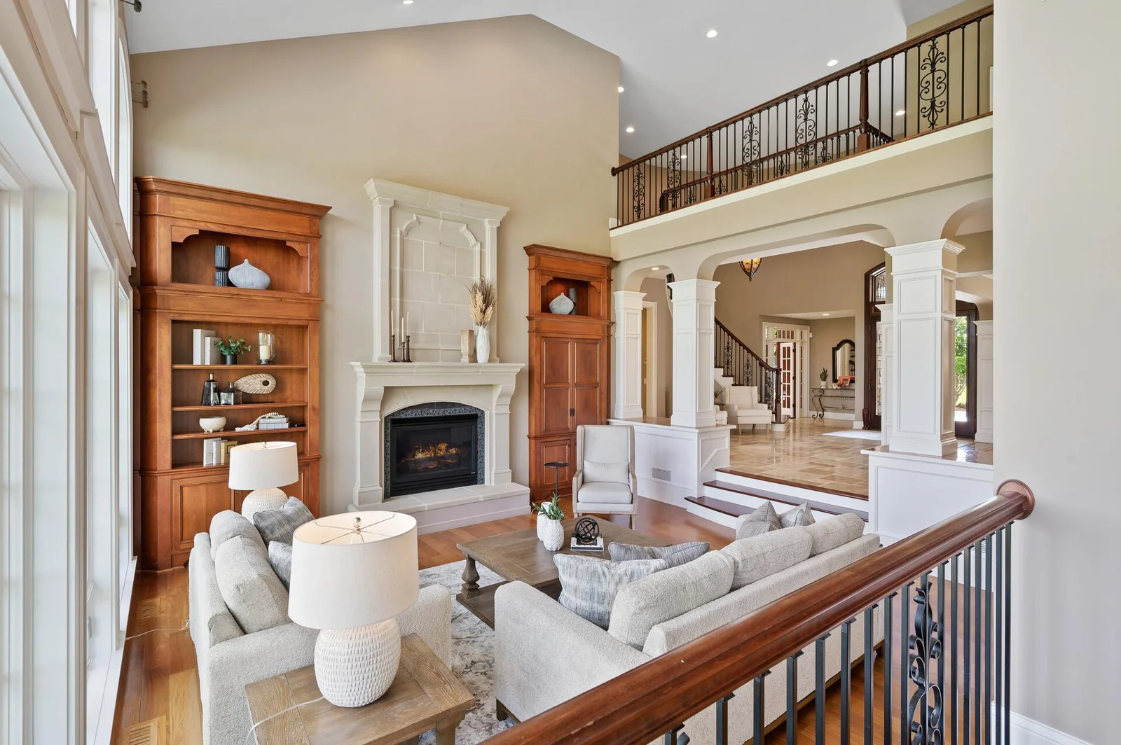 The spacious and inviting living room is the heart of the home with elegant fireplace and open design.
