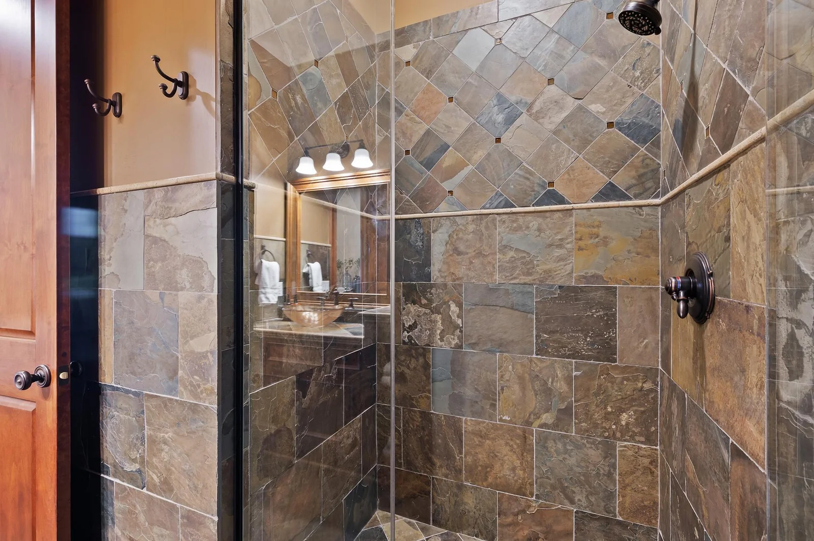 Thoughtful design details enhance the walk-in shower in the lower level bathroom.