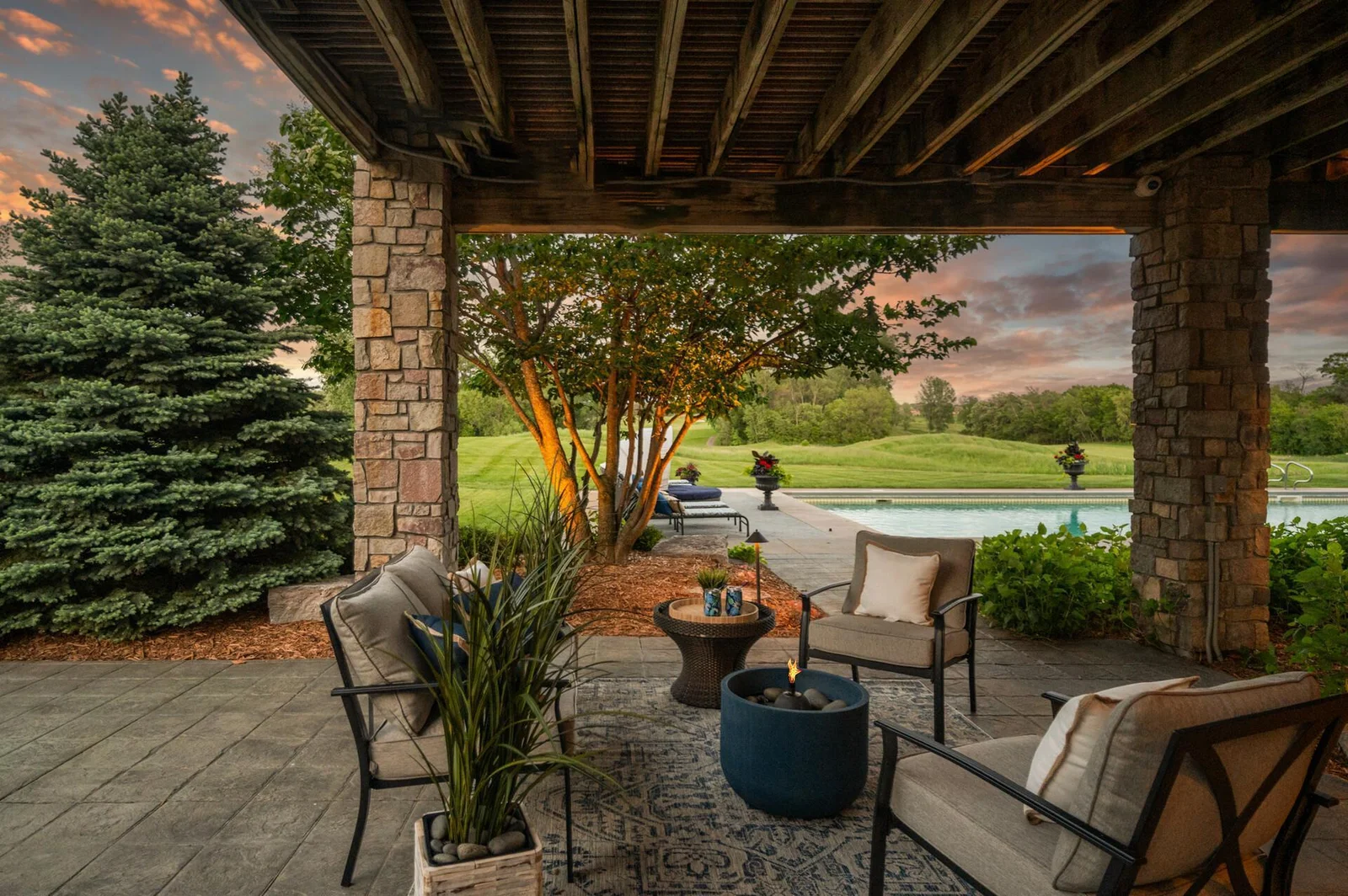 As day turns to night, this covered patio becomes the perfect place to enjoy the tranquility of your evenings.