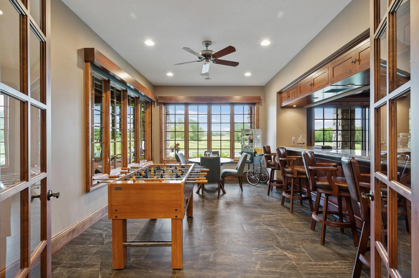 The lower level bar offers a convenient gathering spot with views and access to the game area and theater.