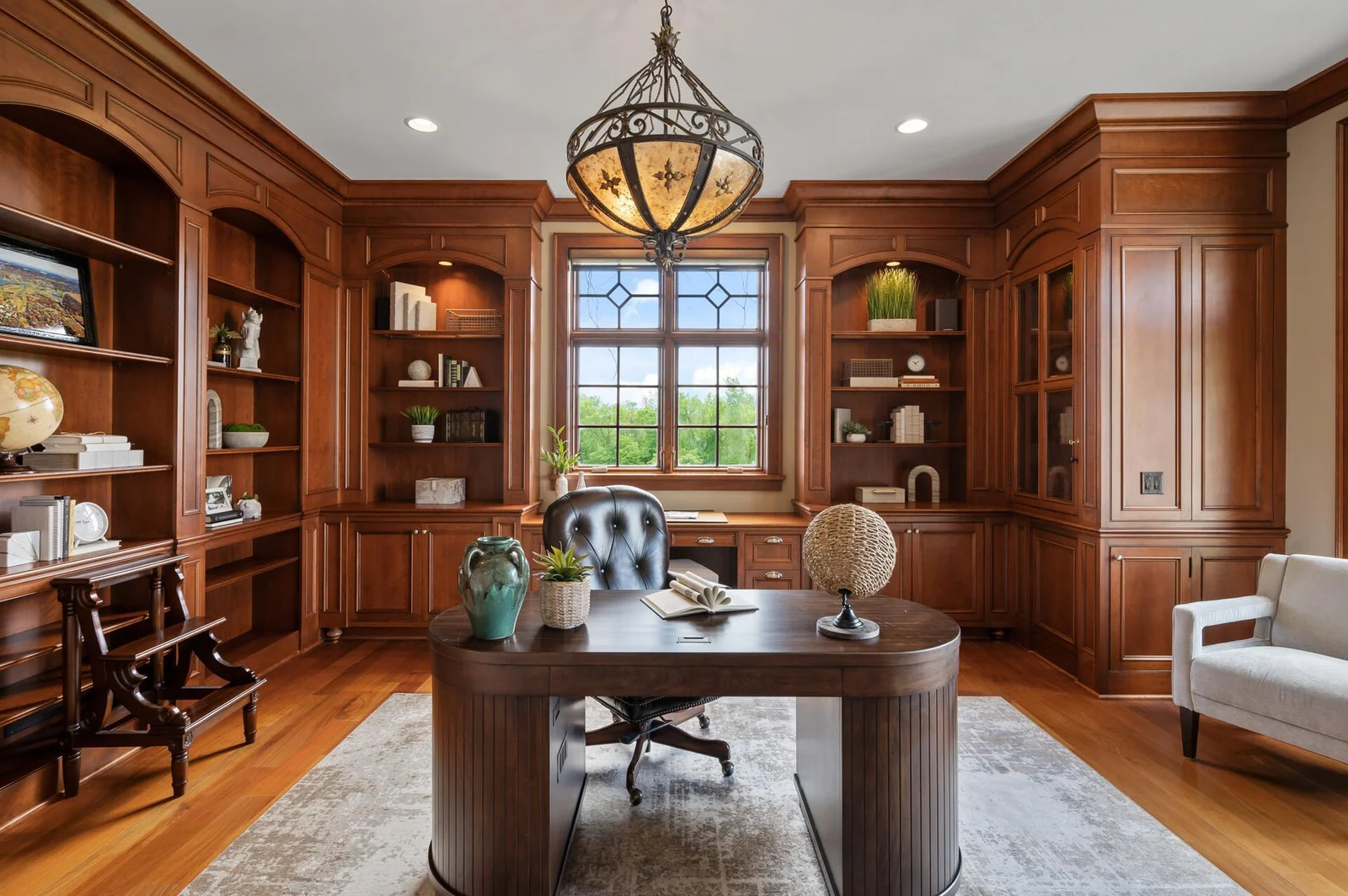 A stylish and professional ambiance defines this beautifully wood-paneled office.