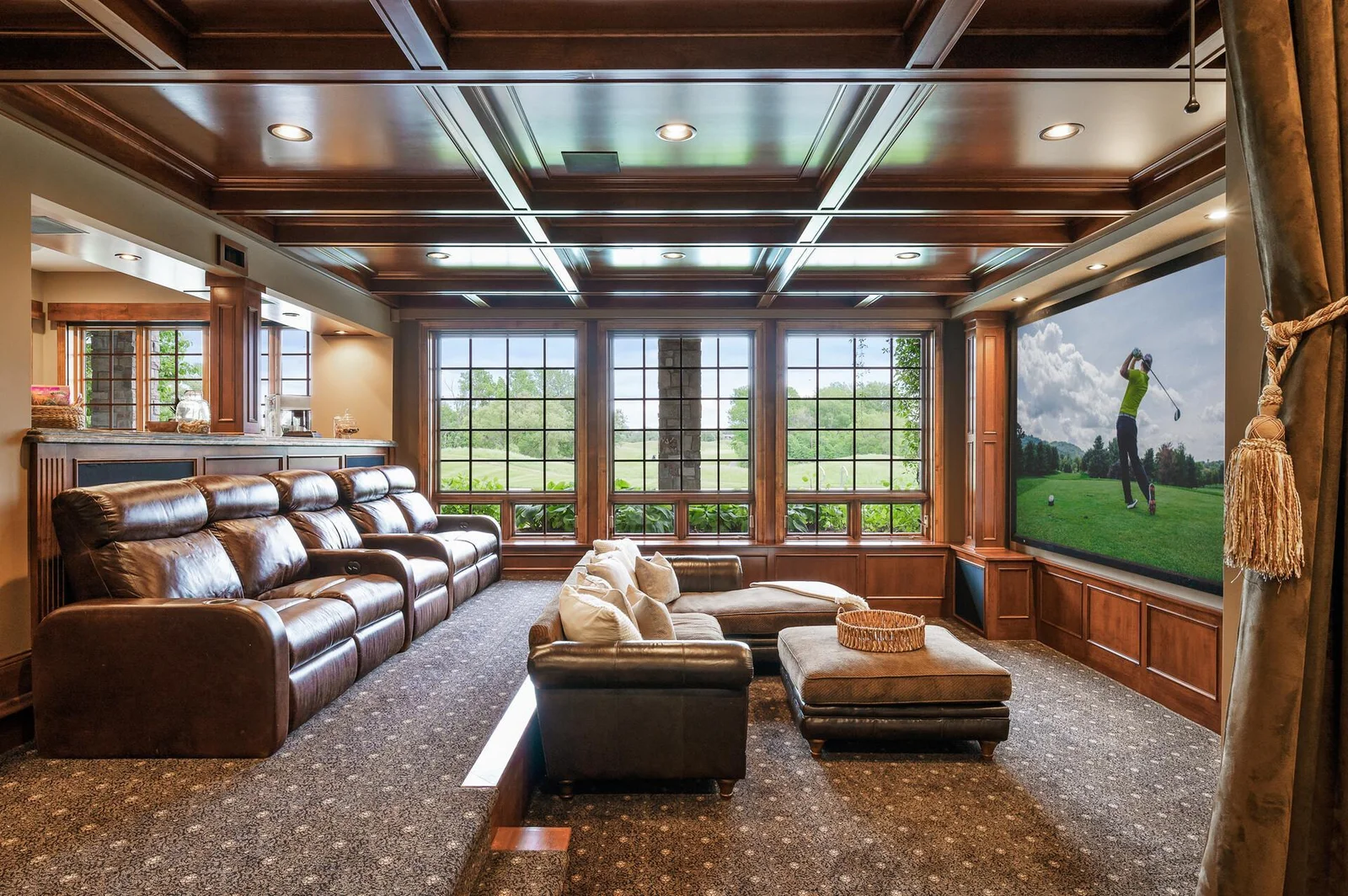 The perfect setup for movie nights and entertainment awaits in the dedicated theater room on the lower level.