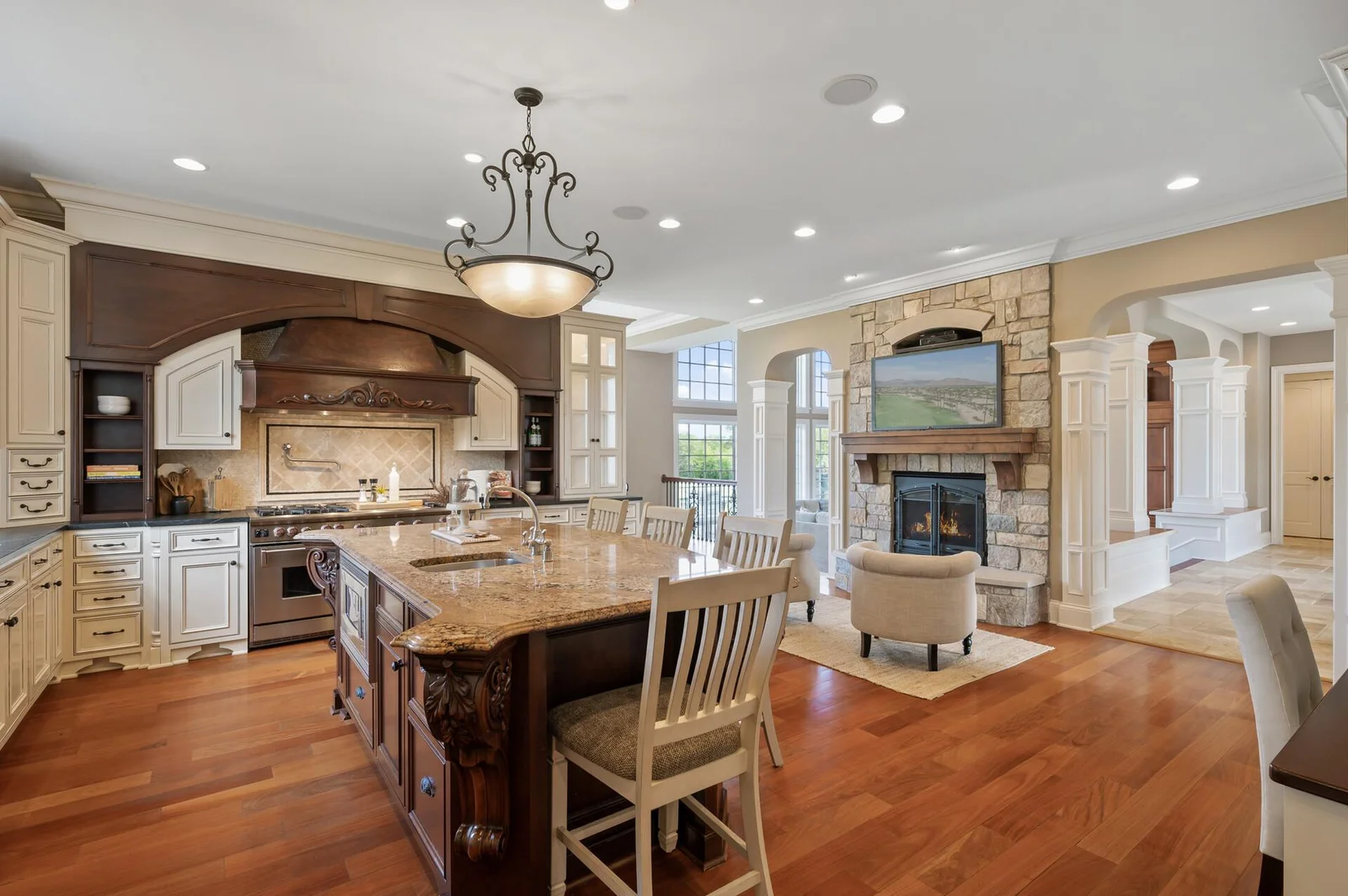 Offering the perfect layout for entertaining, with an open kitchen flowing into a comfortable sitting room with a focal point fireplace.