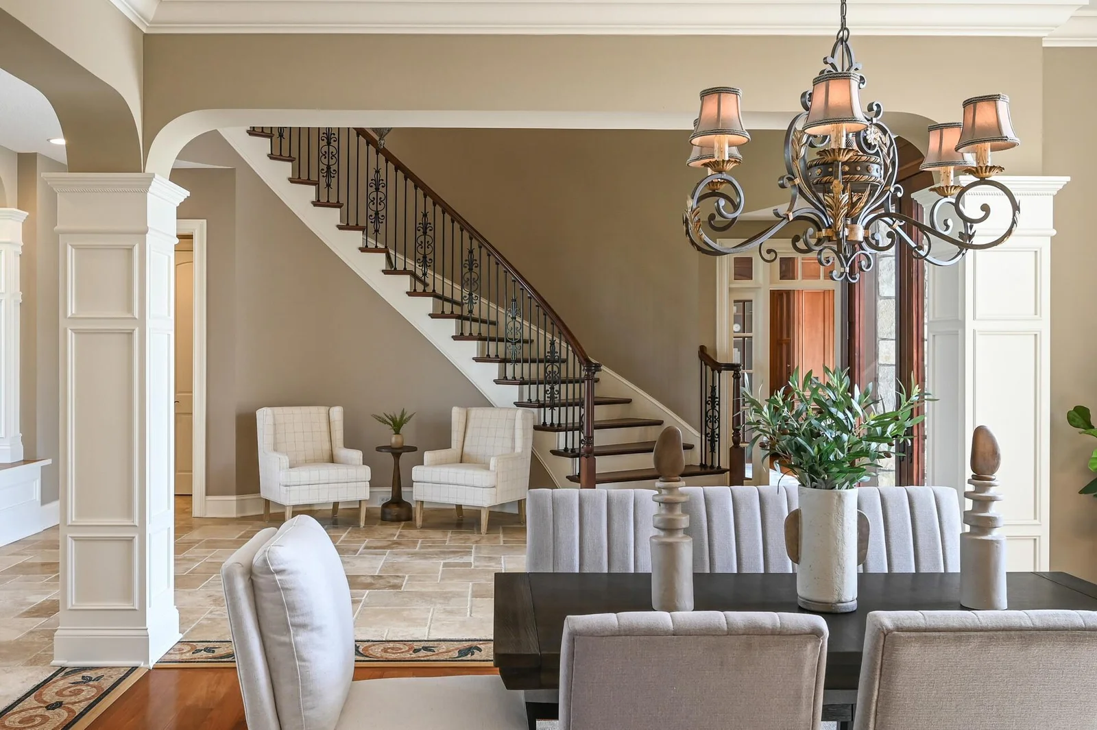 Natural light fills the dining room and foyer, creating a seamless and inviting atmosphere.