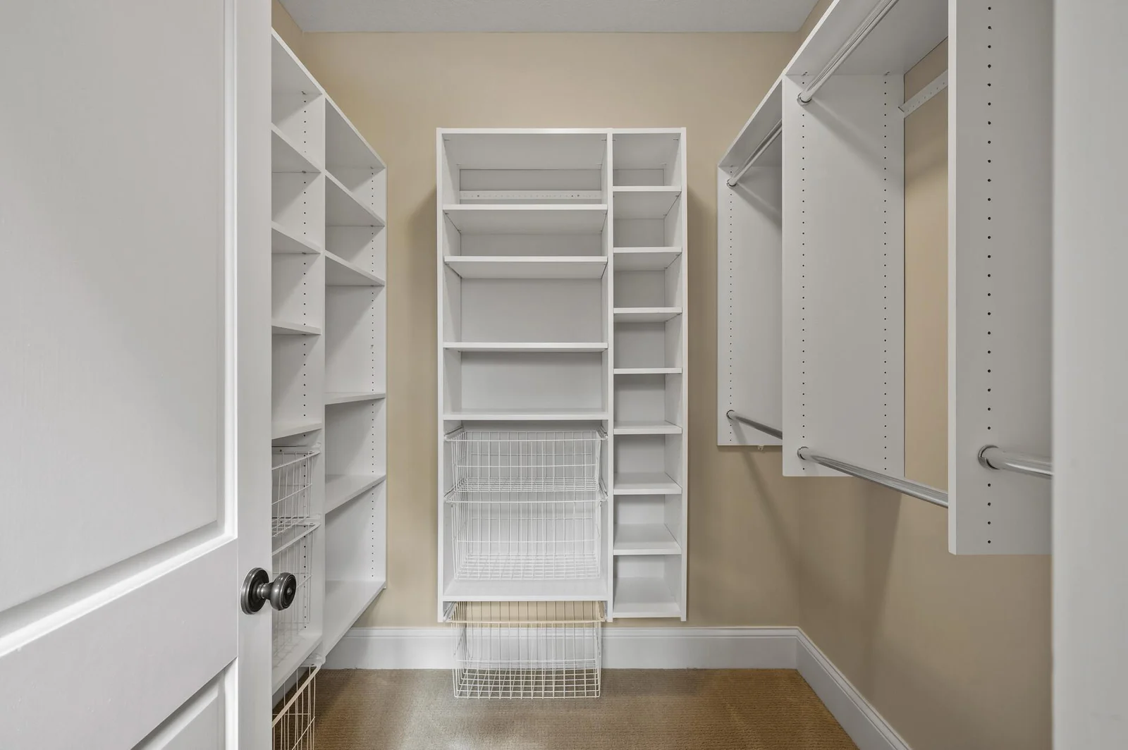 Well-equipped custom walk-in closet providing excellent storage solutions.