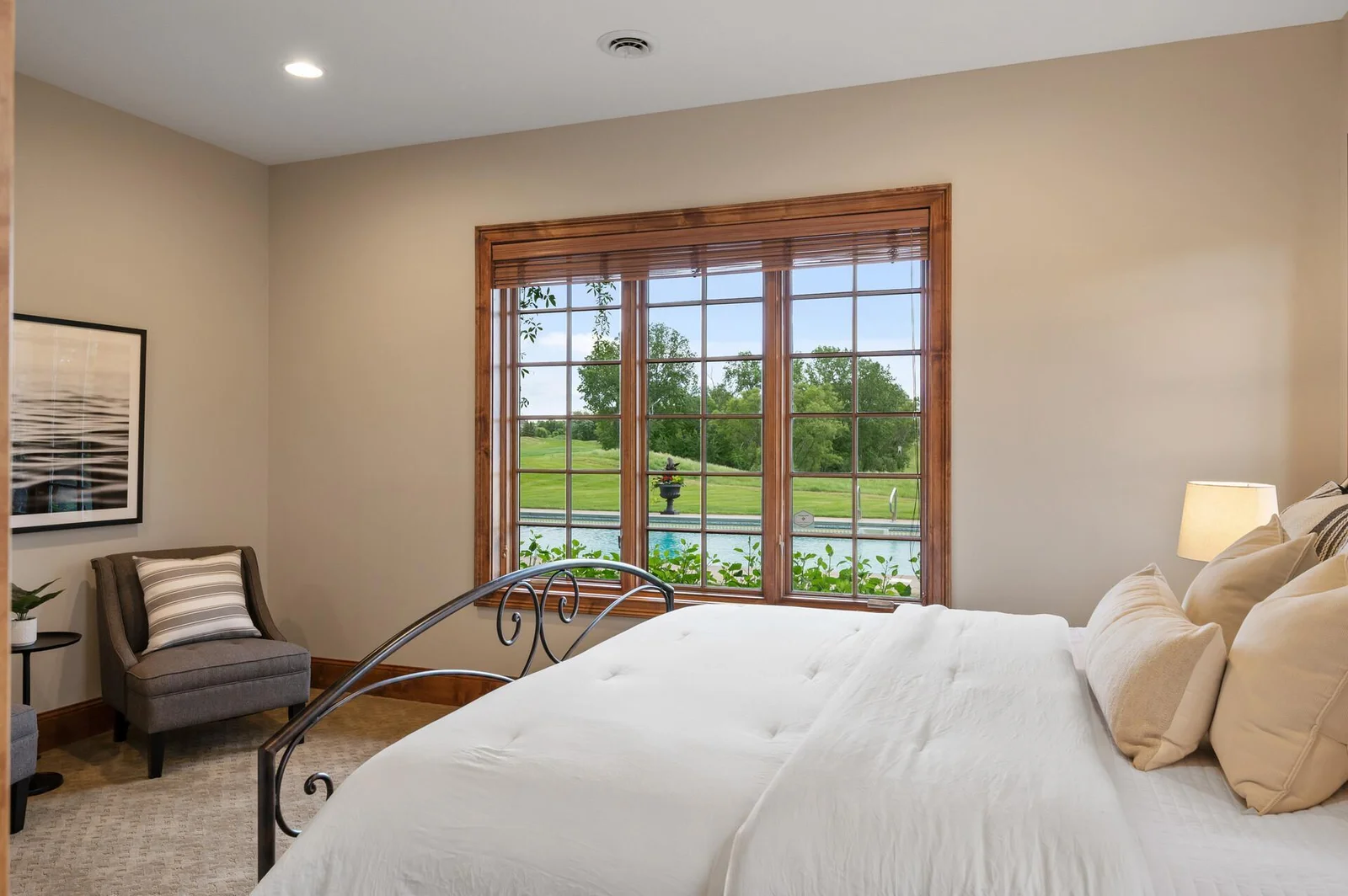 Find tranquility in this lower level bedroom, complete with a view to the surrounding landscape.