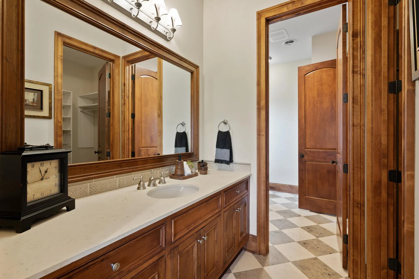 Plenty of countertop space on the vanity in this Jack-and-Jill bathroom connected to the lower level bedroom.