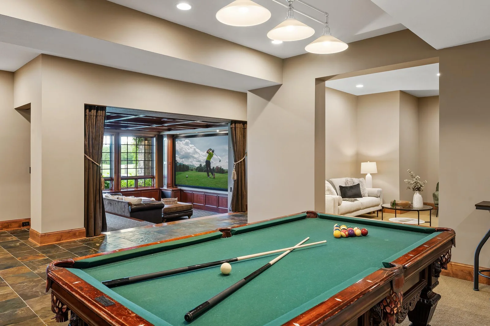 From movie nights to games, the lower level offers diverse entertainment possibilities with a dedicated theater room and a large game space.