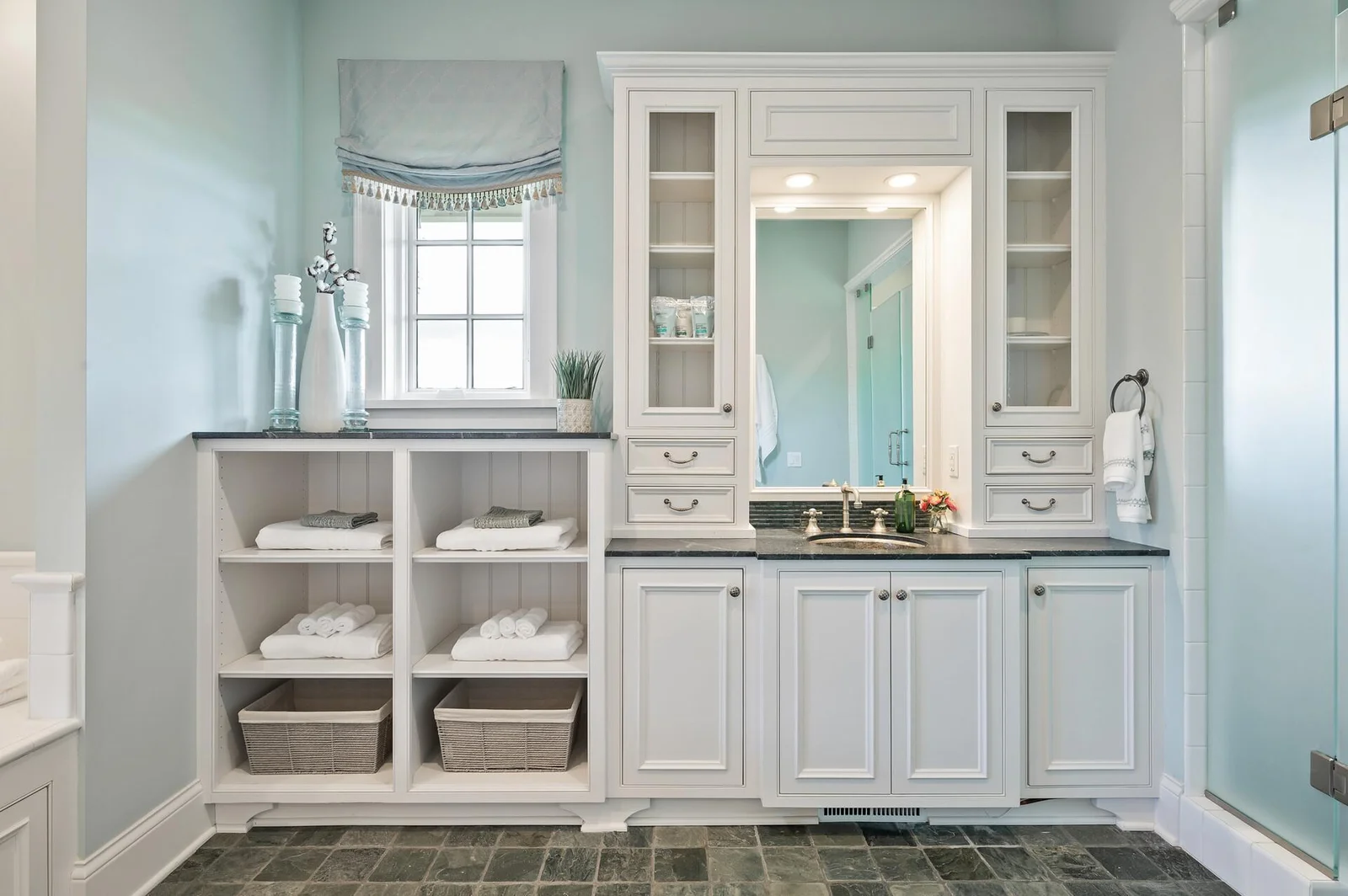 Beautiful and functional vanity area with ample storage and counter space.