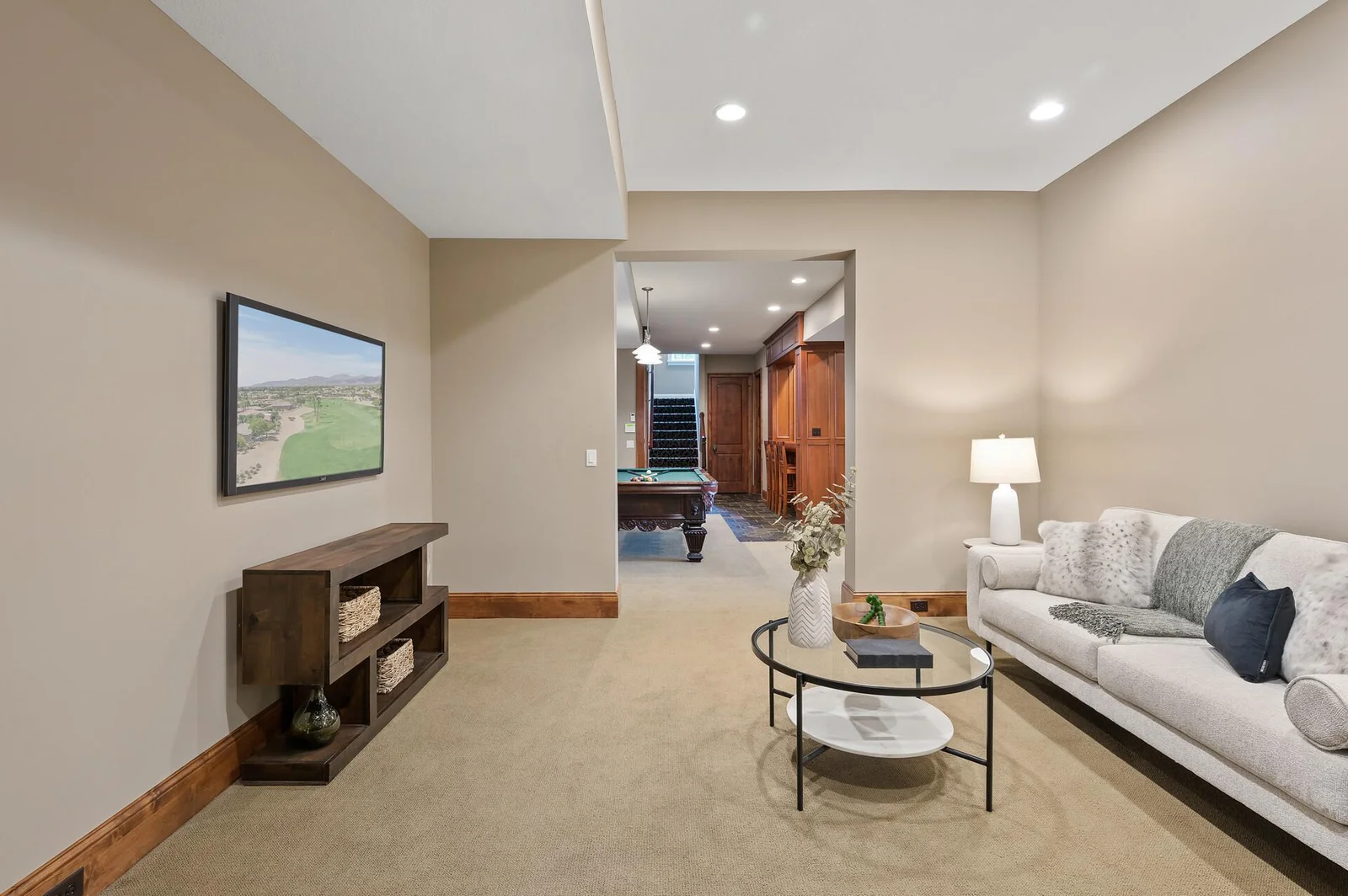 The well-designed layout of the lower level places this comfortable living space within easy reach of the game area.