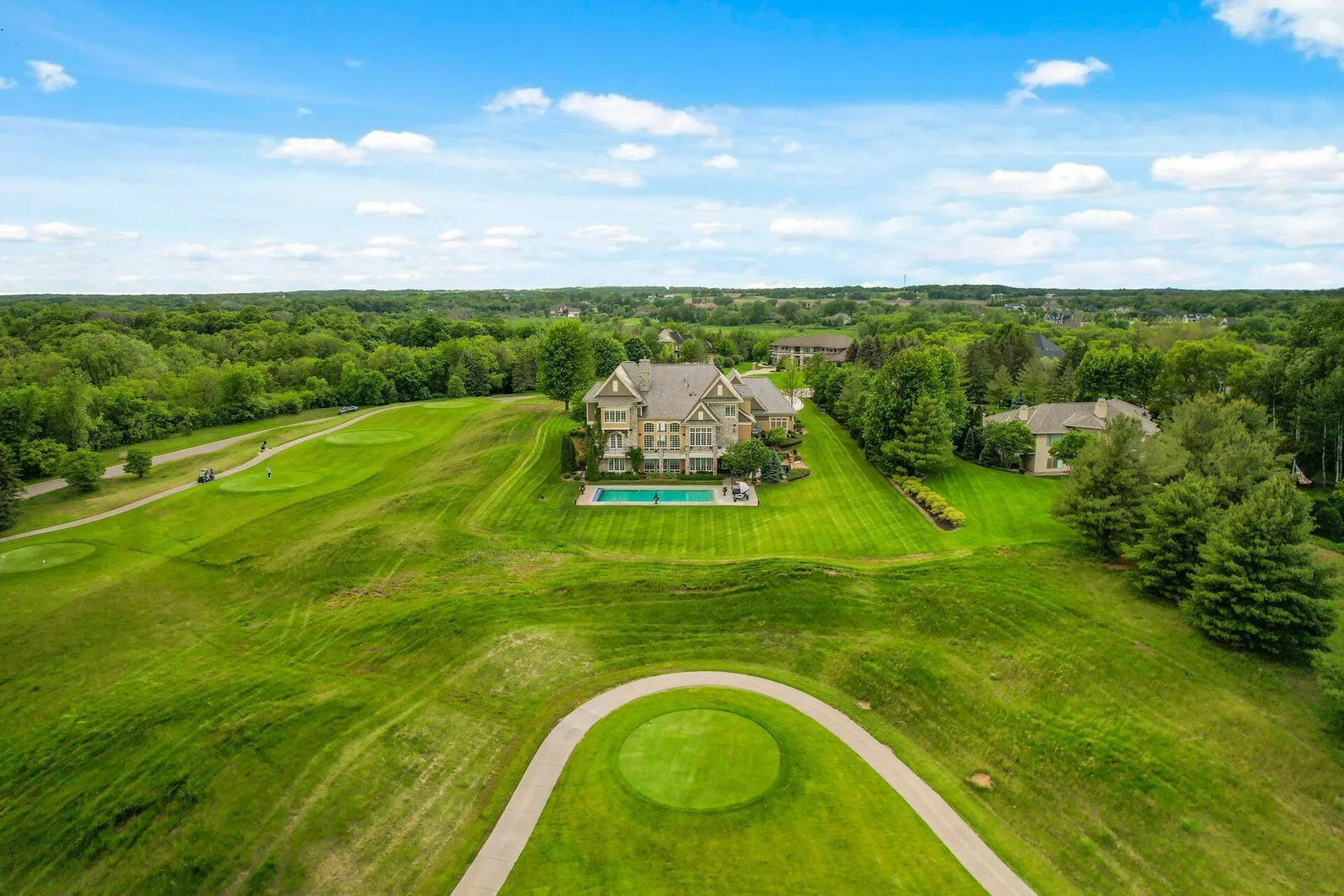 This exceptional estate offers a truly remarkable lifestyle. Situated on a sprawling and meticulously maintained lot directly bordering the prestigious Legends Golf Course, the property provides unparalleled access and stunning views.