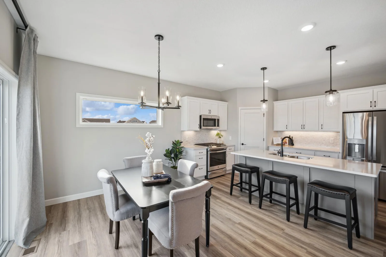 Kitchen_Dining. Photo is of former model home. See Sales Consultant for Specific Colors and Options. Ability to choose!