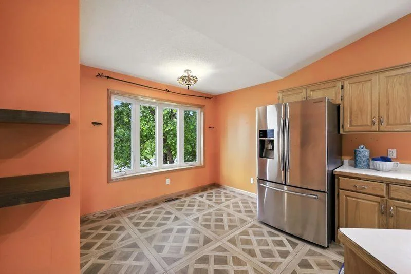 Main level kitchen with eat in dining area + separate formal dining room