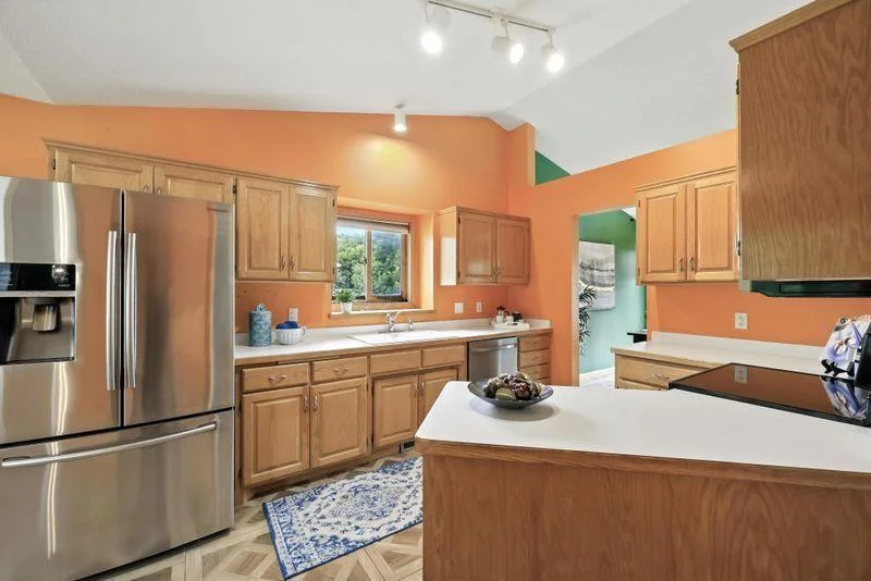 Main level kitchen with eat in dining area + separate formal dining room
