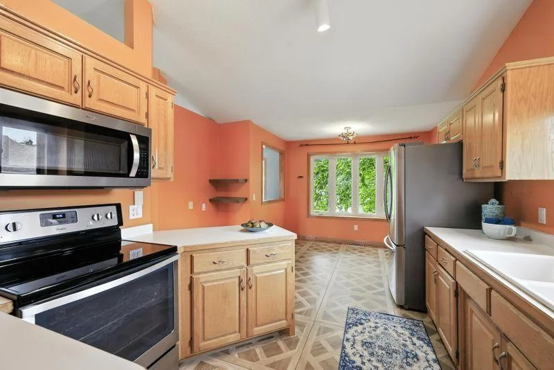 Main level kitchen with eat in dining area + separate formal dining room