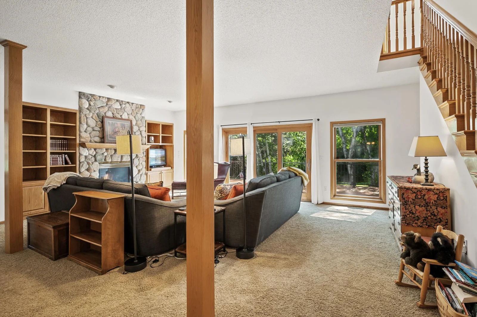 View from the dining room to the living room, deck and backyard