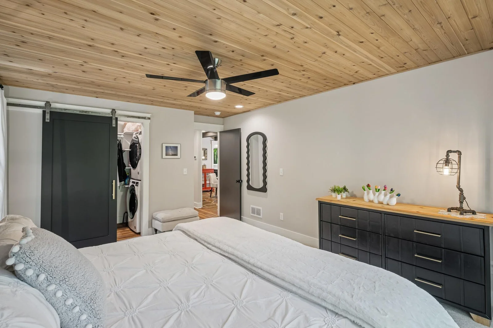 Owners bedroom has large closet with sliding closet door which provides access to full size laundry stack for convenience.
