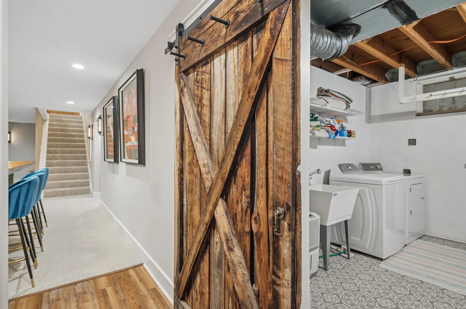 Tucked away and stylishly hidden storage room and additional laundry area for ease and convenience.
