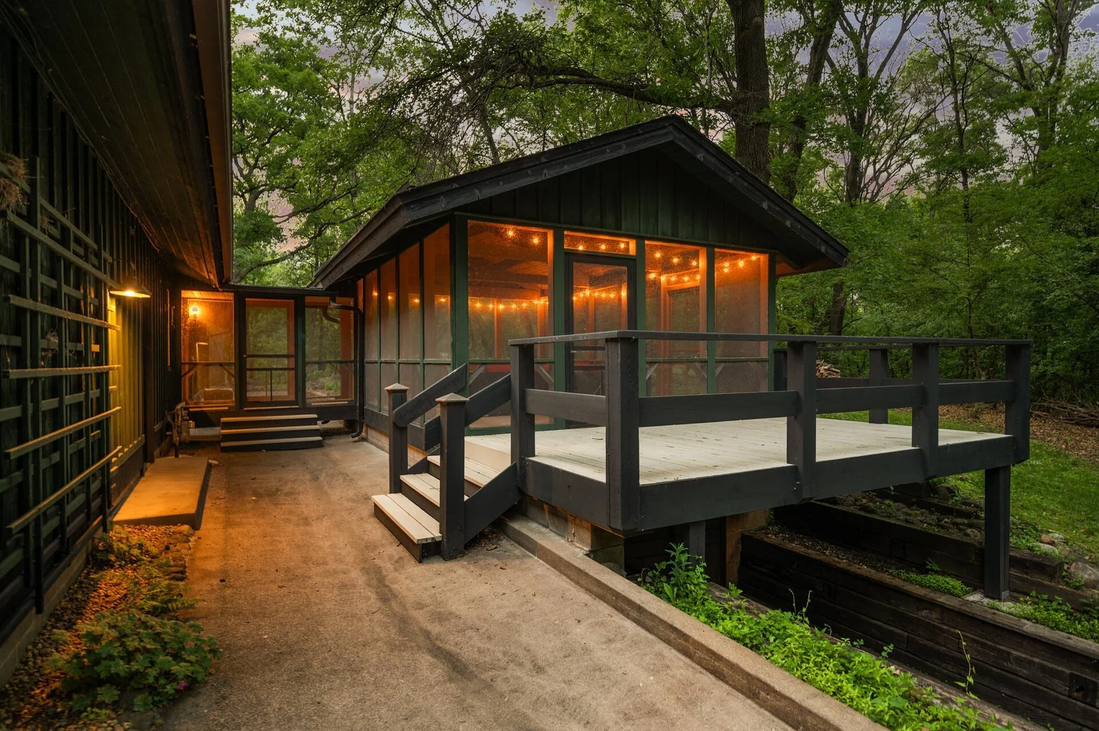 Quaint, thoughful covered breezeway allows you access to the outdoor screened in spaces, as well as easy access point for entertaining without having to walk through the home.