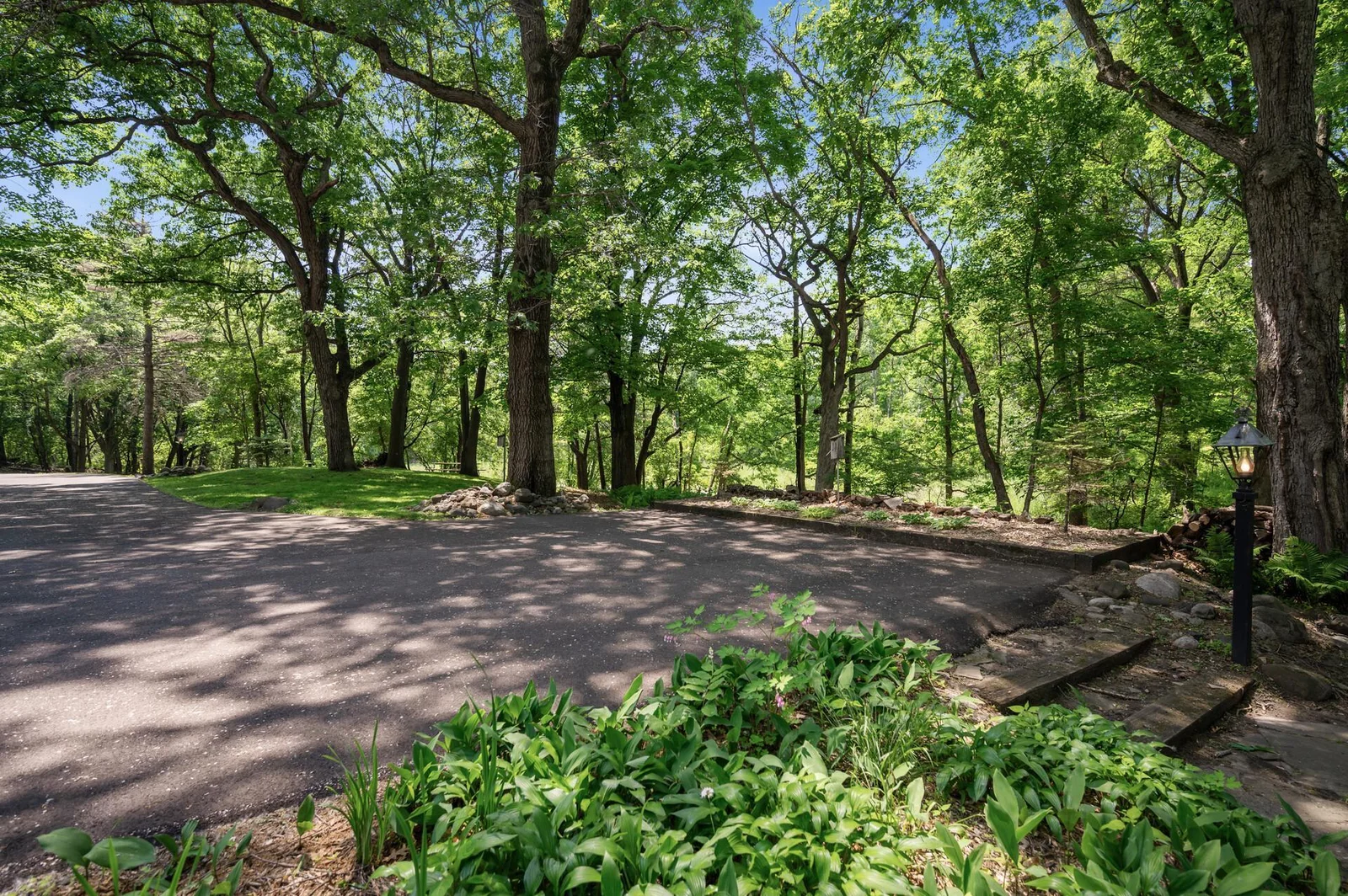 Large driveway has additional parking area that overlooks your private pond.  Space could accomodate an additonal living structure like a carport with upstairs living area for guests or family.