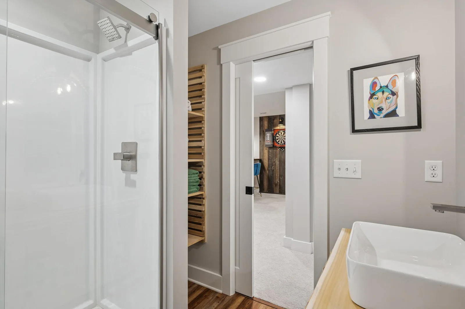 Custom shelving with adjustable shelf heights is great for storage without sacrificing style!
