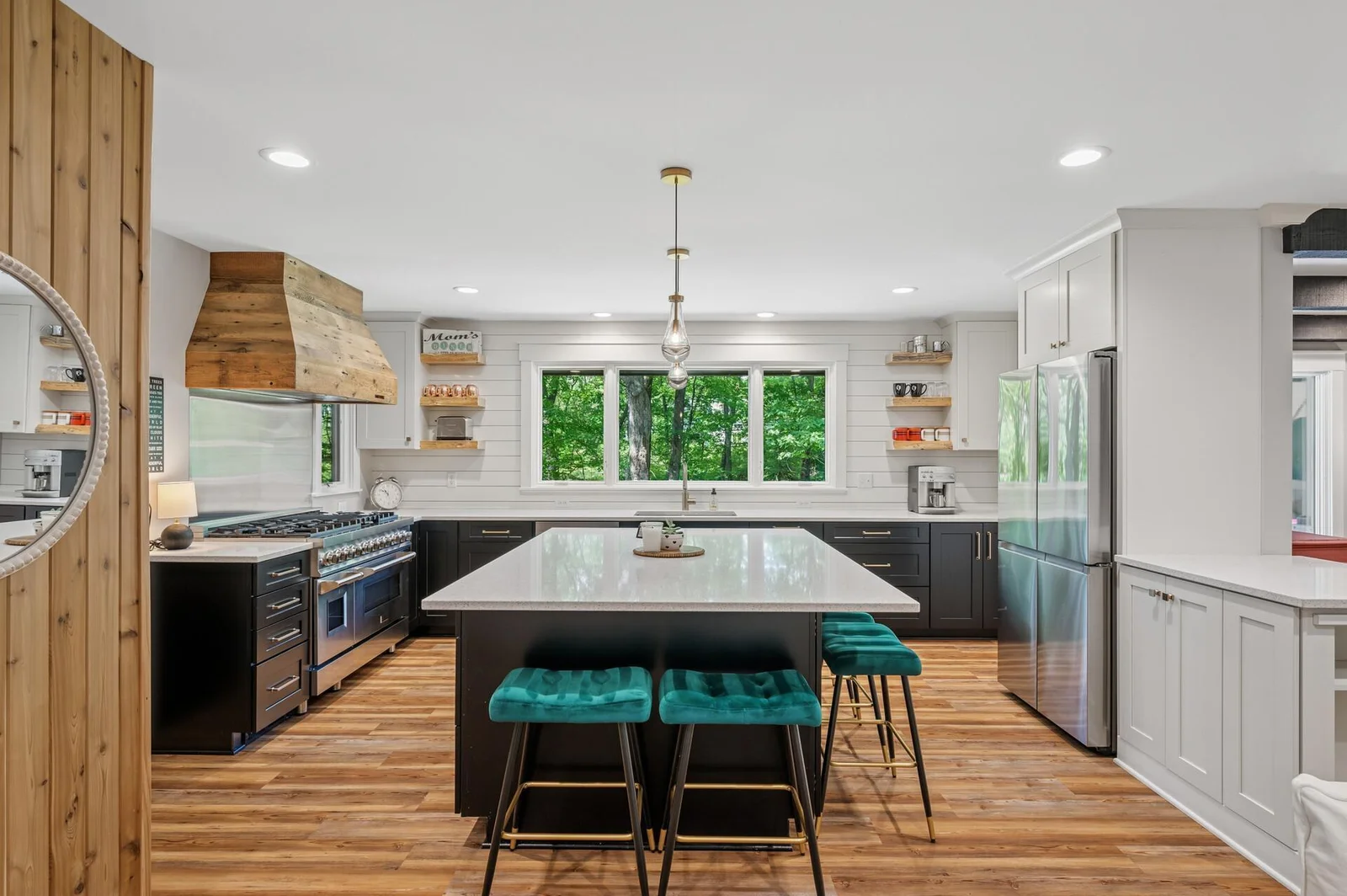 High end custom finishes blend seamlessly with modern, thoughtful design.  Quartz countertops, ZLINE professional 8 burner range, Sharp microwave drawer, Samsung 4 door FlexZone refrigerator.