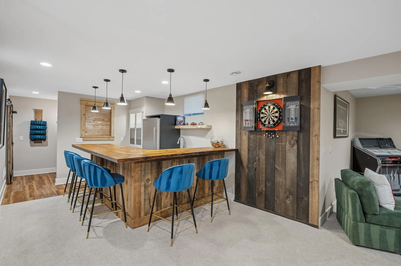 Finished lower level includes handcrafted live edge slab wood bar, cedar sauna, large gathering room complete with gas fireplace.