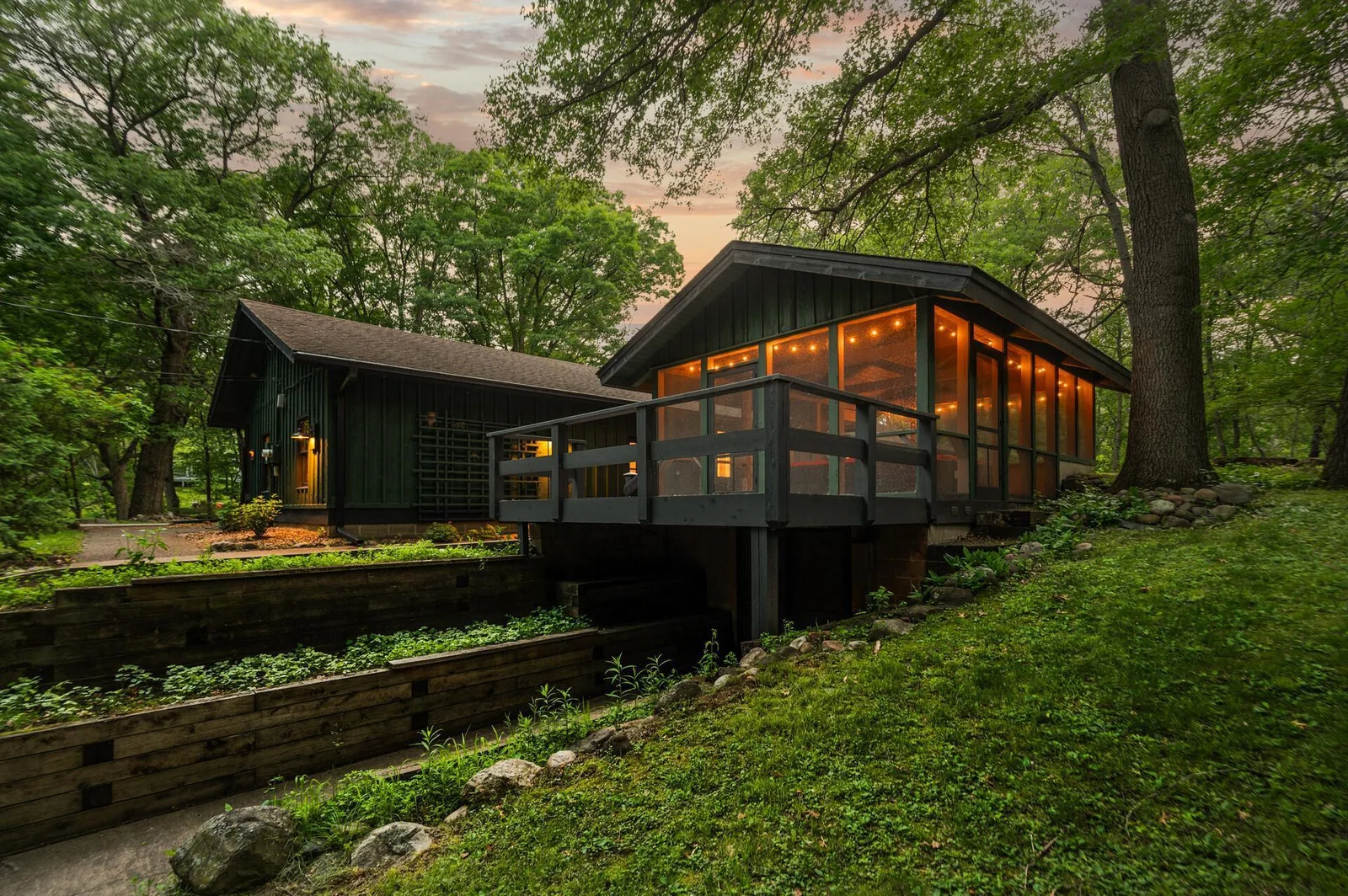 Lush natural beauty with throughful landscaping, retaining walls, multiple outdoor spaces and intential design that blends with the natural surroundings.