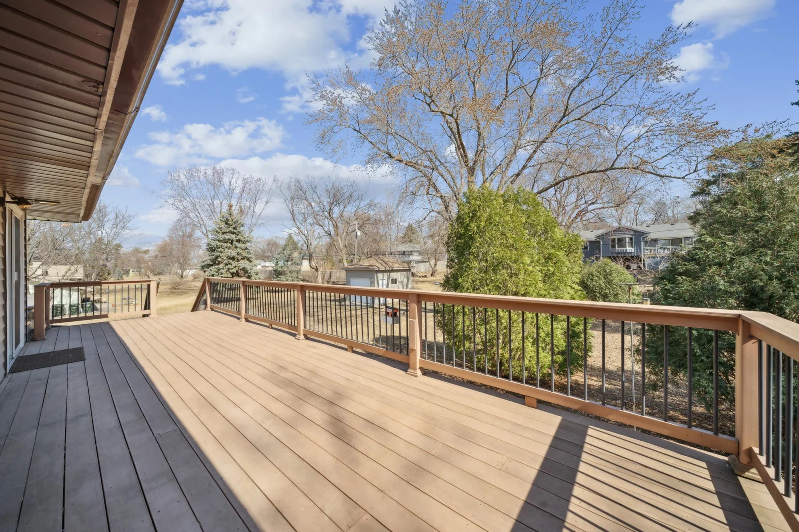 18. Full view of the composite decking and upgraded railing.  Also the single detached garage is off to the left of the deck