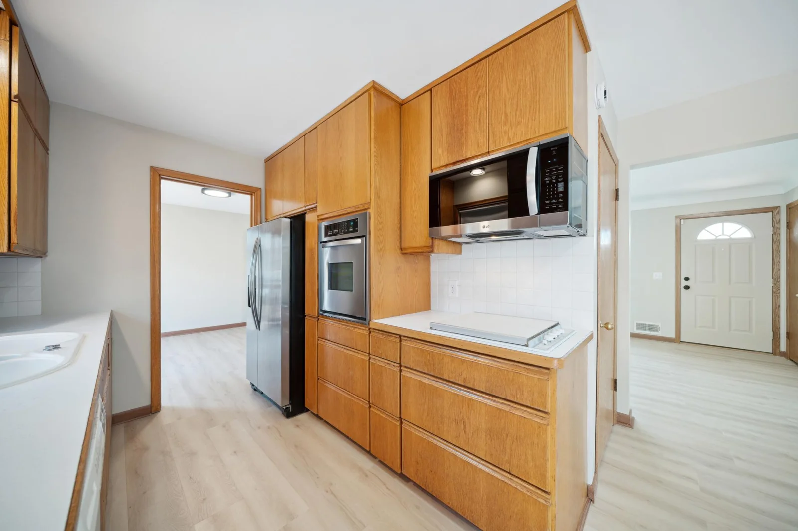 Eauopean kitchen featuring the stainless steel refrigerator, convection wall oven and microwave